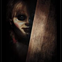 Trends International Annabelle - Peek Wall Poster, 22.375" x 34", Unframed Version